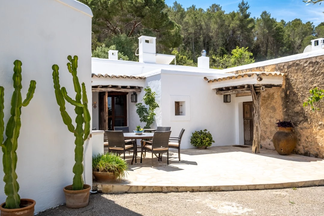 1684146340-Prospectors Luxury real estate Ibiza to rent villa Can Xauret spain property parking sea outside.webp